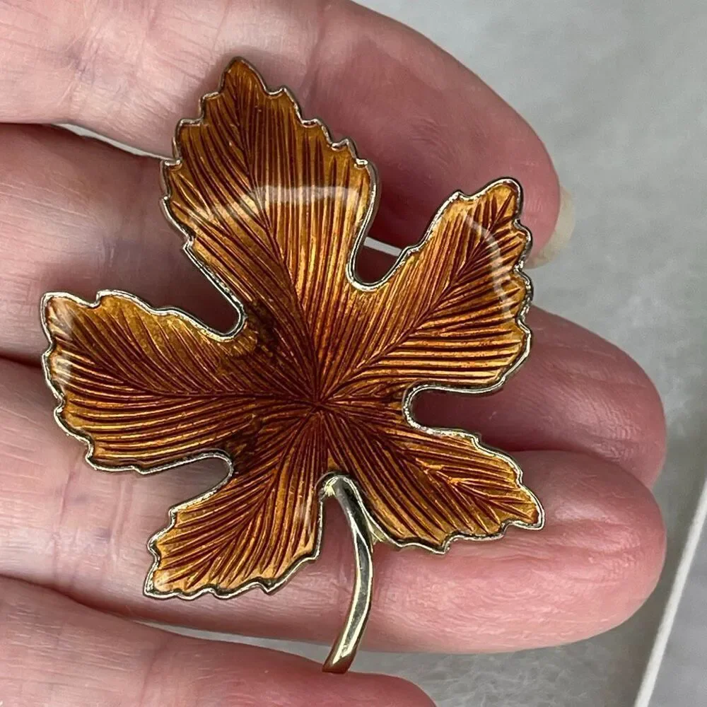 Vintage enamel maple leaf brooch.